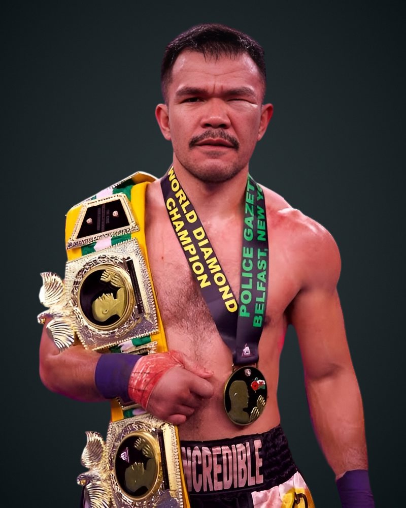 Rolando The Incredible Dy with his BKB championship belt over his shoulder and a Police Gazette World Diamond Champion medal